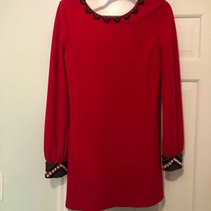 Red dress with wrist and neck embellishments